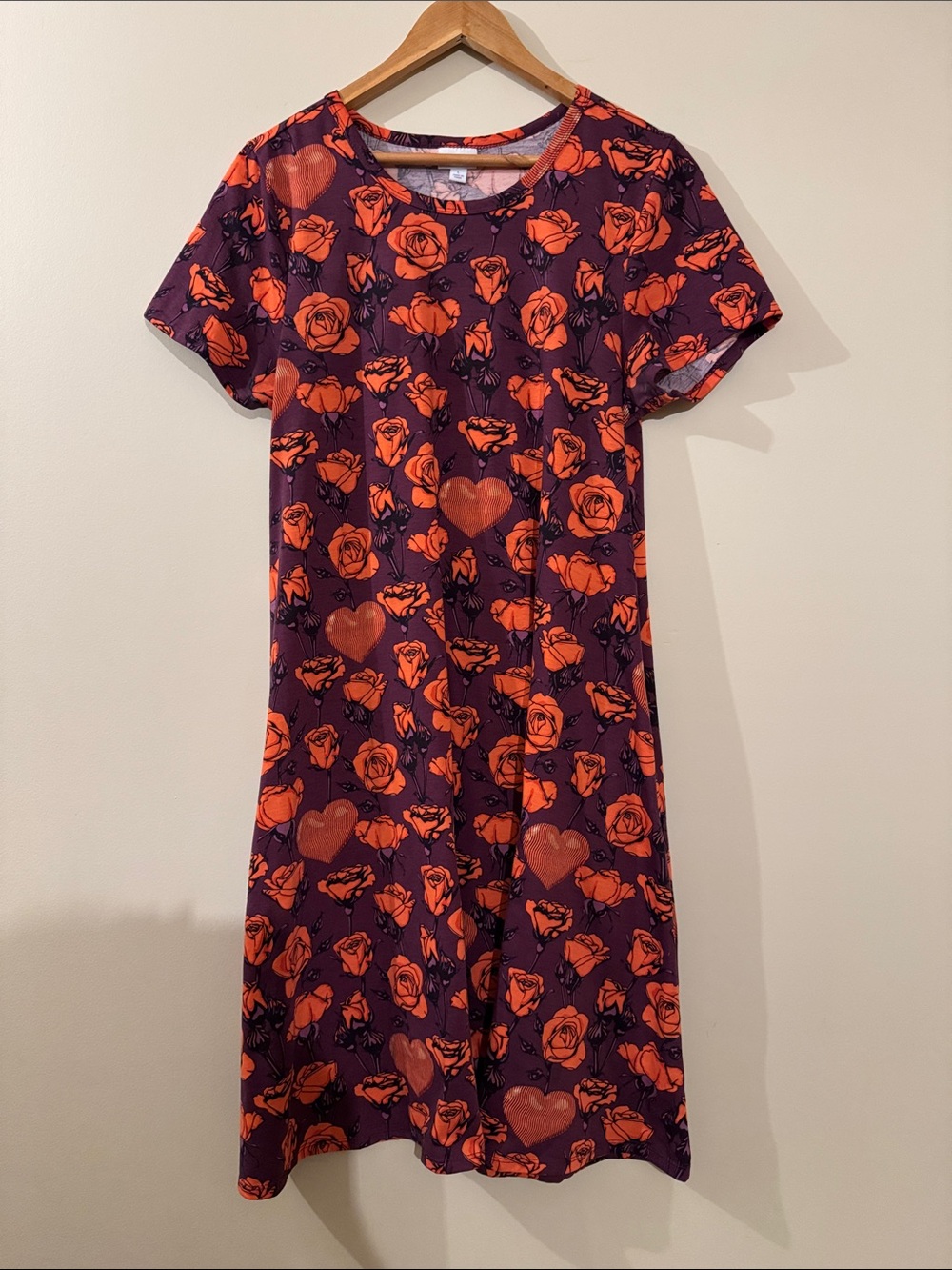 LuLaRoe Purple Floral Tee with Orange Accents size L. Pockets